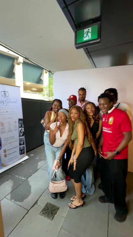 A big group celebrating at the booth