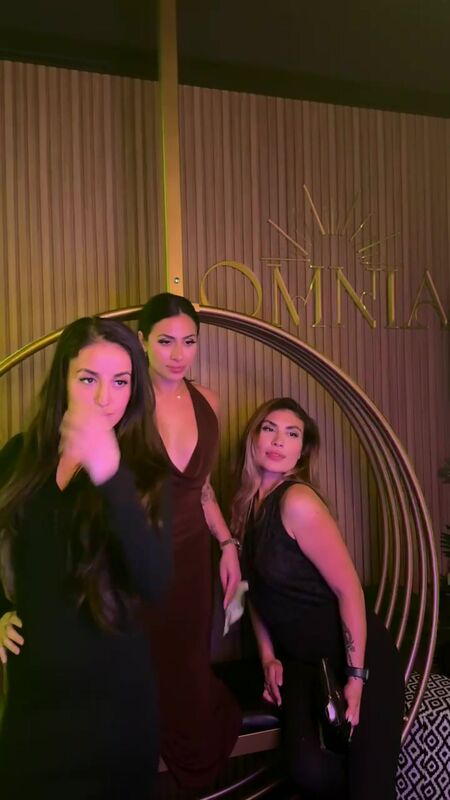 Guests at the HYSPARKS photo booth in a luxury lounge