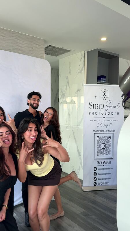 Guests posing at the Snap Social booth